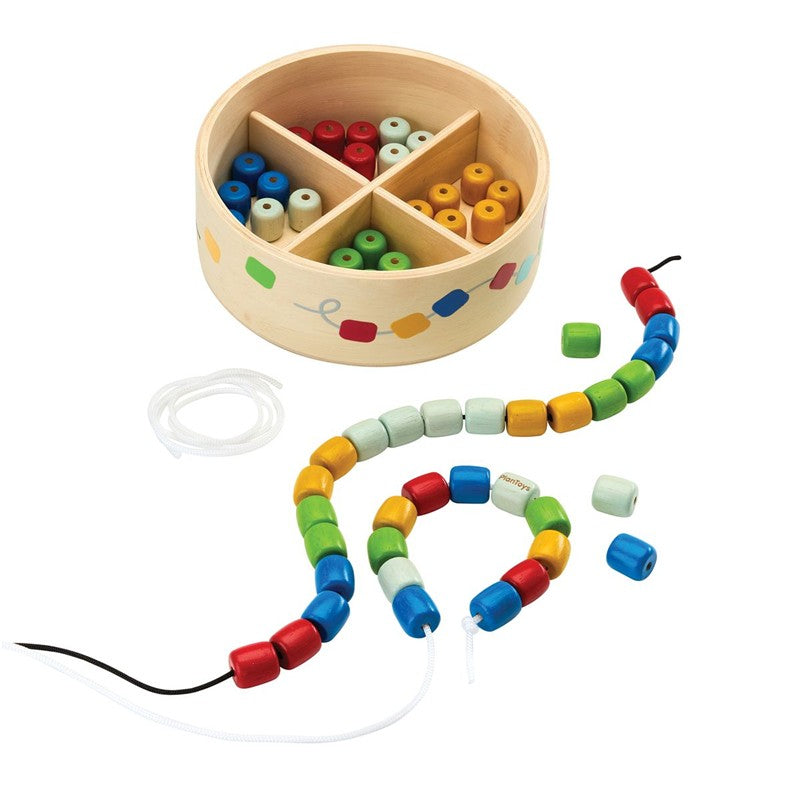 Caja enhebrar cuentas de madera – PlanToys